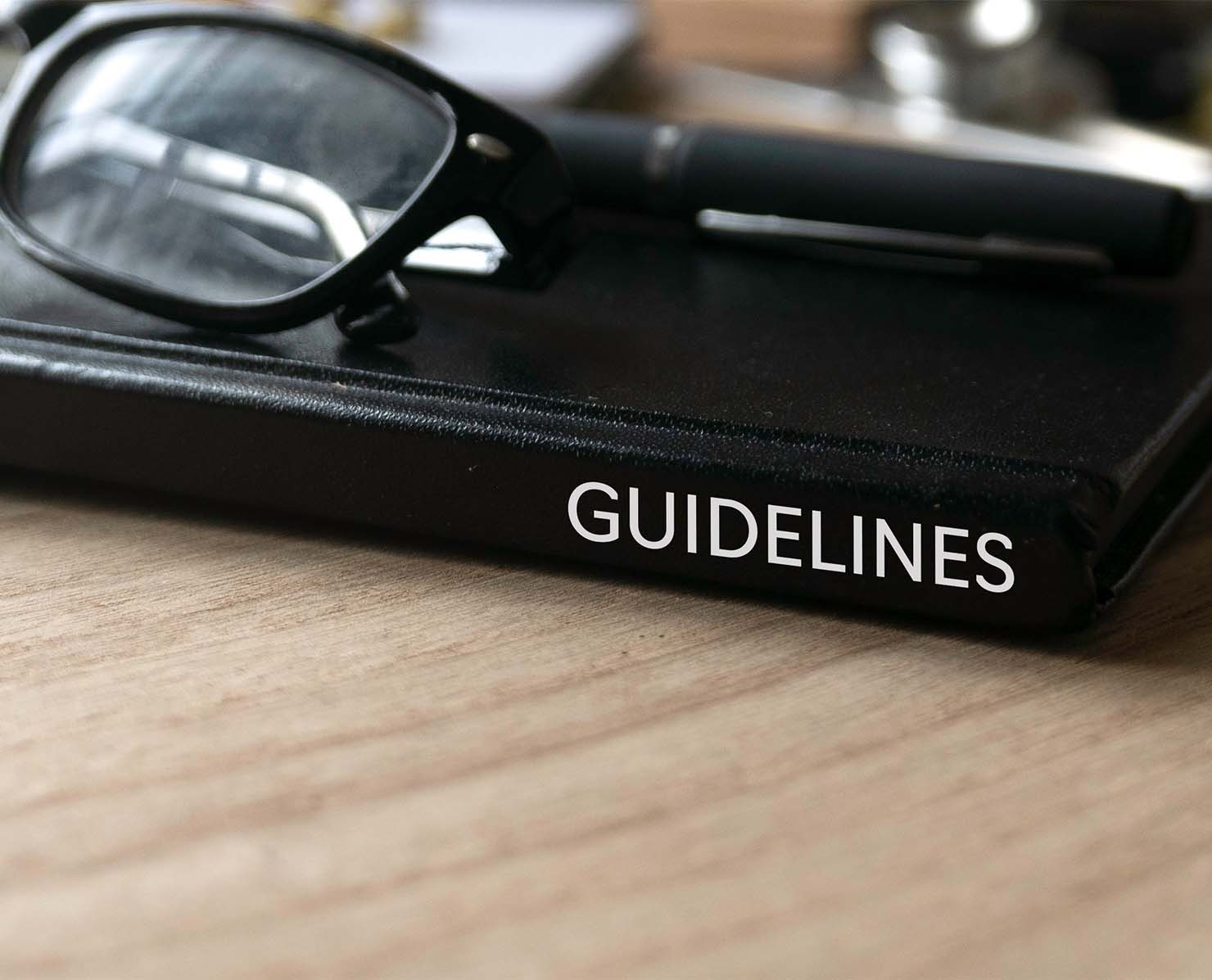 Glasses on top of guidelines book